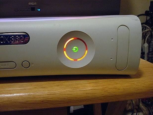 The Xbox 360 Red Ring of Death (RROD) showing three flashing red lights indicator